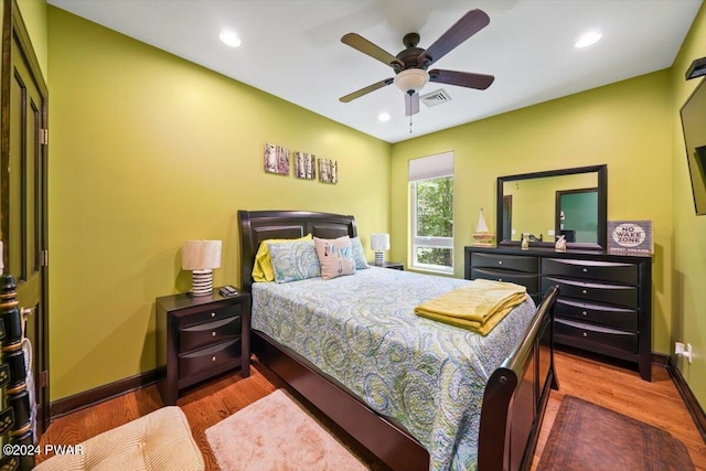 bedroom featuring ceiling fan and hardwood / wood-style flooring