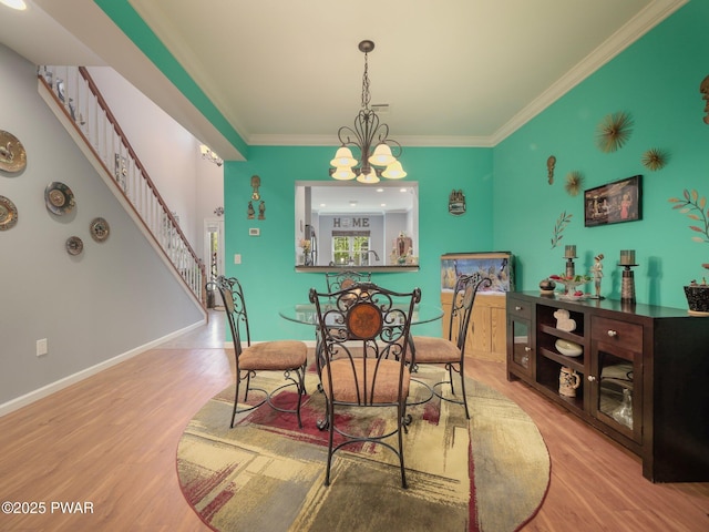 803 Macintosh Way, Matamoras, PA 18336 - dining room featuring crown molding, baseboards, stairs, and wood finished floors
