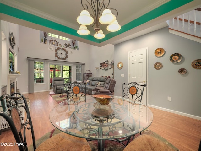 803 Macintosh Way, Matamoras, PA 18336 - dining room featuring baseboards, a chandelier, ornamental molding, and wood finished floors