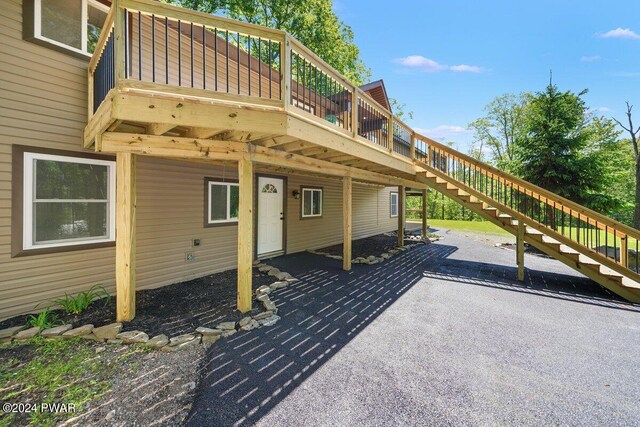 exterior space featuring a wooden deck