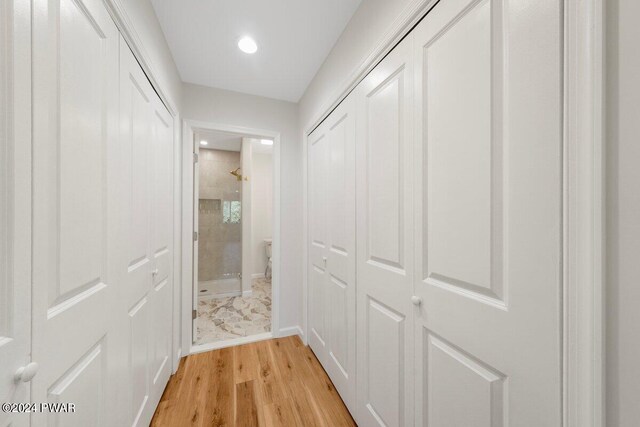 hall with light hardwood / wood-style flooring