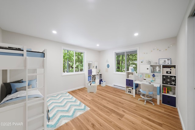 109 Widgeon Ln, Lords Valley, PA 18428 - bedroom featuring multiple windows, wood finished floors, recessed lighting, and baseboard heating