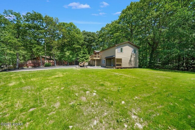 view of yard with a wooden deck