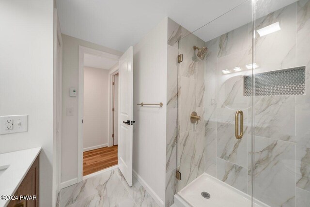 bathroom featuring vanity and walk in shower