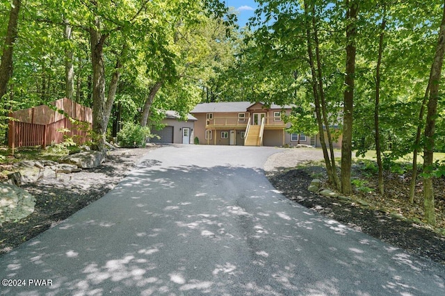 109 Widgeon Ln, Lords Valley, PA 18428 - view of front of house with a garage, stairs, and driveway