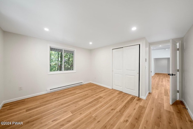 109 Widgeon Ln, Lords Valley, PA 18428 - unfurnished bedroom featuring a baseboard radiator, light wood-style floors, a closet, and recessed lighting