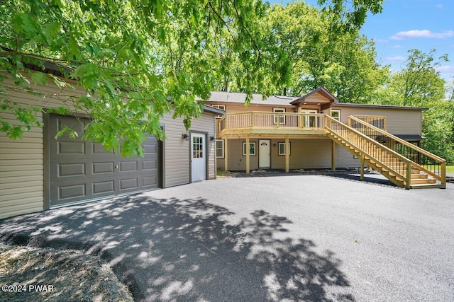 109 Widgeon Ln, Lords Valley, PA 18428 - view of front of house with stairs, a deck, and driveway
