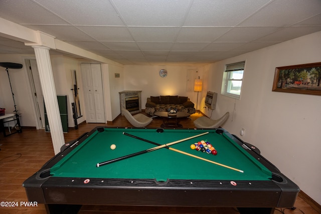 recreation room with wood-type flooring, heating unit, a drop ceiling, and pool table