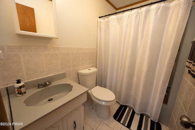 bathroom with vanity, a shower with shower curtain, tile patterned flooring, toilet, and tile walls