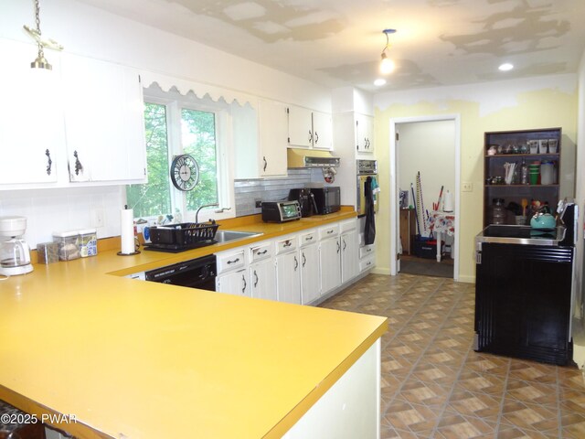 115 Eastwood Dr, Greentown, PA 18426 - kitchen featuring tasteful backsplash, light countertops, white cabinets, black dishwasher, and recessed lighting
