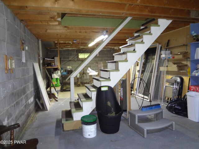 115 Eastwood Dr, Greentown, PA 18426 - unfinished below grade area featuring stairway and concrete block wall
