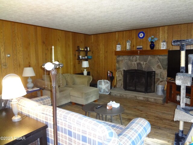 115 Eastwood Dr, Greentown, PA 18426 - living area featuring wooden walls, wood finished floors, and a fireplace