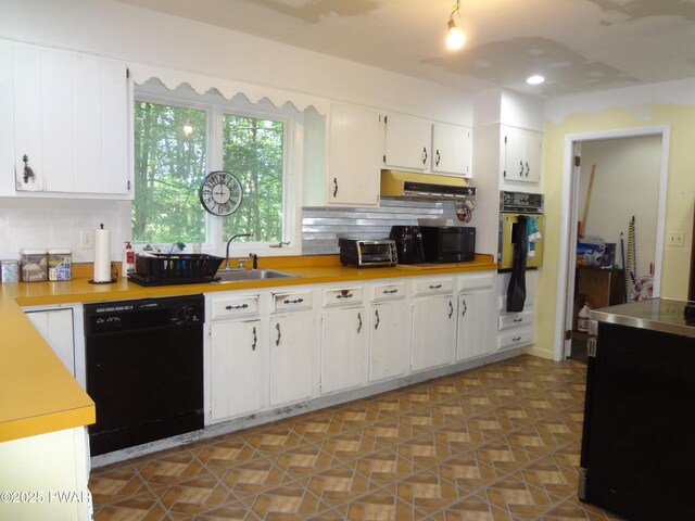115 Eastwood Dr, Greentown, PA 18426 - kitchen featuring black appliances, light countertops, backsplash, white cabinets, and under cabinet range hood