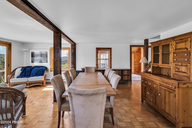 dining room featuring light parquet floors