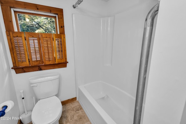 bathroom with toilet and tub / shower combination