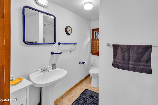 bathroom with tile patterned flooring, toilet, and sink