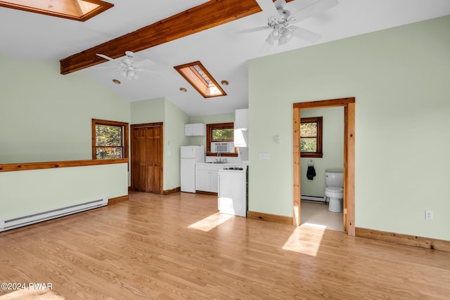 unfurnished living room featuring light wood-type flooring, a baseboard radiator, lofted ceiling with skylight, and ceiling fan