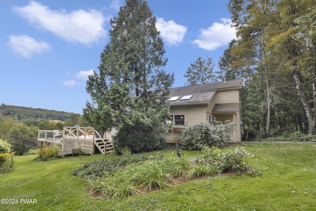 view of yard featuring a deck