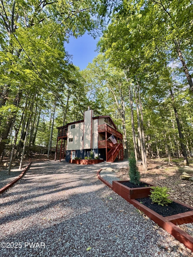13 Huron Ct, Lake Ariel, PA 18436 - view of side of home with a wooden deck, stairway, and gravel driveway