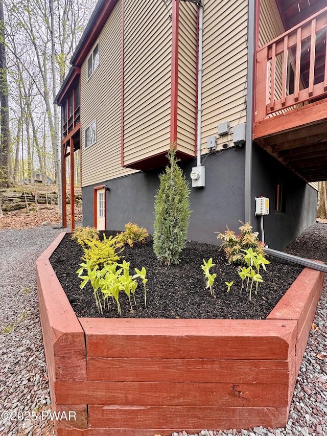 view of property exterior featuring a deck