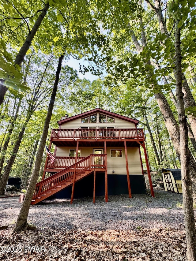 13 Huron Ct, Lake Ariel, PA 18436 - back of house featuring a deck, stairs, and a storage unit