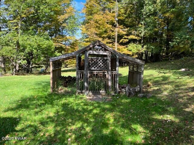 view of outbuilding featuring a yard