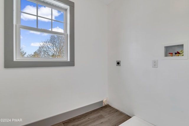 laundry room featuring hookup for a washing machine, hardwood / wood-style floors, and hookup for an electric dryer