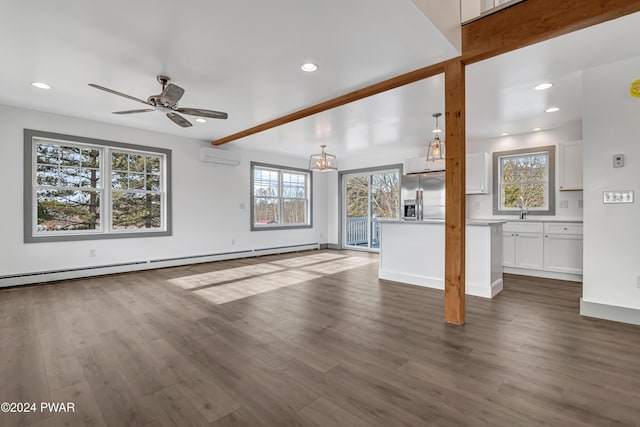 5 Lakeville Ct, Lakeville, PA 18438 - unfurnished living room featuring a ceiling fan, dark wood-type flooring, a wall mounted AC, recessed lighting, and a baseboard heating unit