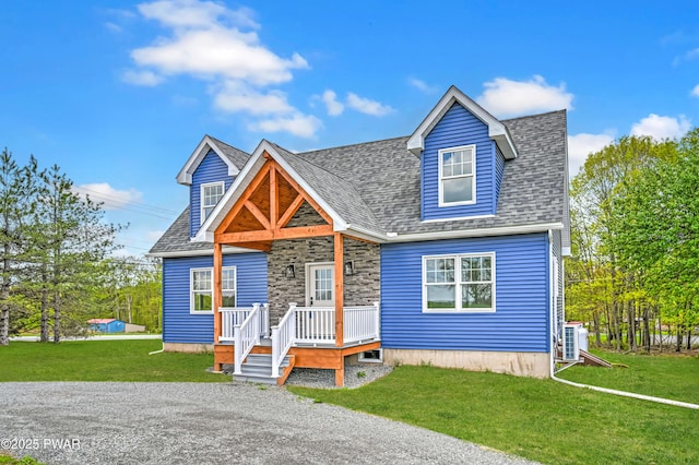 5 Lakeville Ct, Lakeville, PA 18438 - view of front of home featuring a front yard, cooling unit, a shingled roof, and stone siding