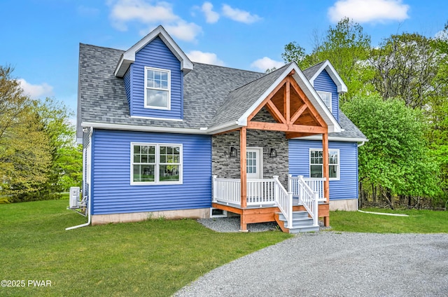 5 Lakeville Ct, Lakeville, PA 18438 - view of front facade with a front yard, roof with shingles, and covered porch