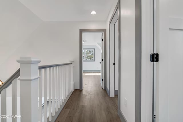 corridor with wood-type flooring