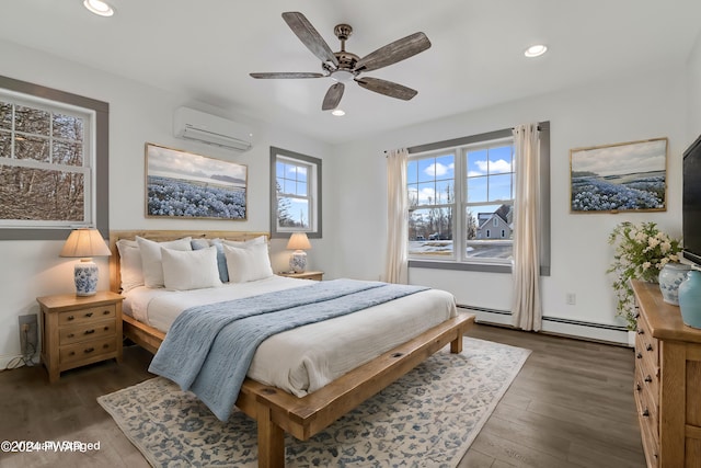 bedroom with ceiling fan, a baseboard heating unit, dark hardwood / wood-style flooring, and a wall mounted AC