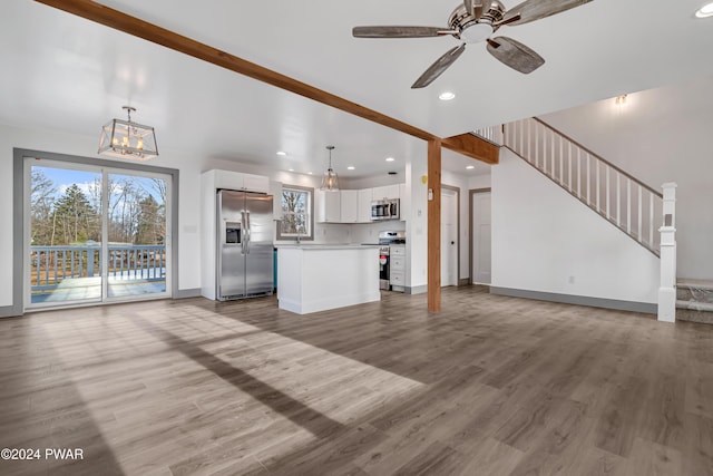 5 Lakeville Ct, Lakeville, PA 18438 - unfurnished living room featuring light wood-style flooring, a chandelier, baseboards, ceiling fan, and recessed lighting