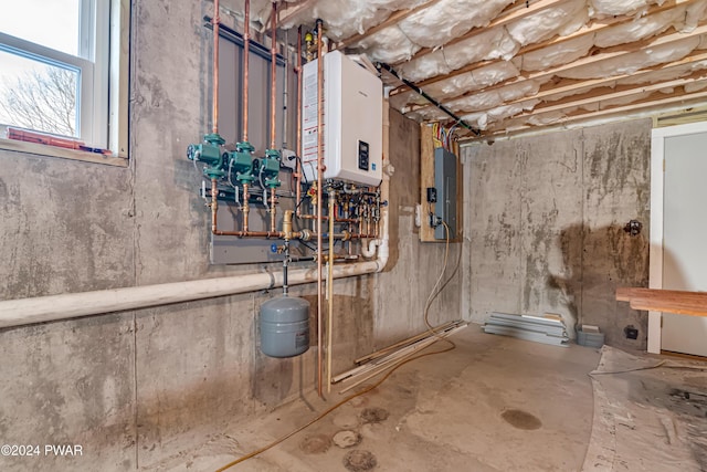 utility room featuring electric panel and water heater