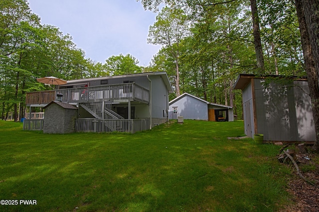 127 E Mulberry Dr, Milford, PA 18337 - rear view of property featuring stairs, a yard, a deck, and a storage shed