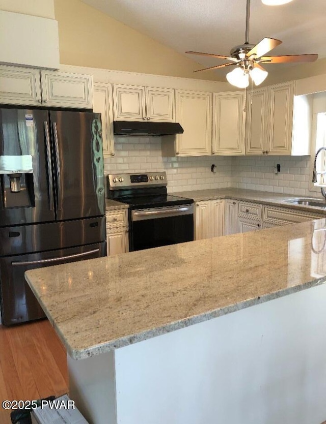 127 E Mulberry Dr, Milford, PA 18337 - kitchen featuring refrigerator with ice dispenser, stainless steel range with electric cooktop, under cabinet range hood, ceiling fan, and light stone counters
