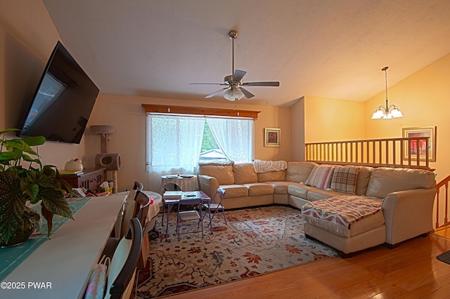 127 E Mulberry Dr, Milford, PA 18337 - living room featuring wood finished floors, a ceiling fan, lofted ceiling, and a chandelier