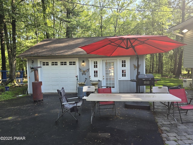 127 E Mulberry Dr, Milford, PA 18337 - view of patio / terrace with an outdoor structure, an attached garage, asphalt driveway, and area for grilling