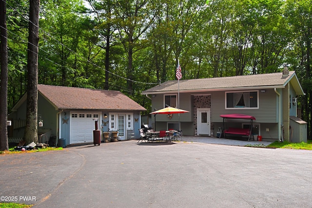 127 E Mulberry Dr, Milford, PA 18337 - view of front of home with an outbuilding, a chimney, and driveway