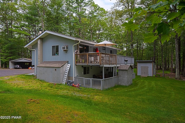 127 E Mulberry Dr, Milford, PA 18337 - rear view of house featuring a storage unit, stairs, a yard, a wooden deck, and view of scattered trees