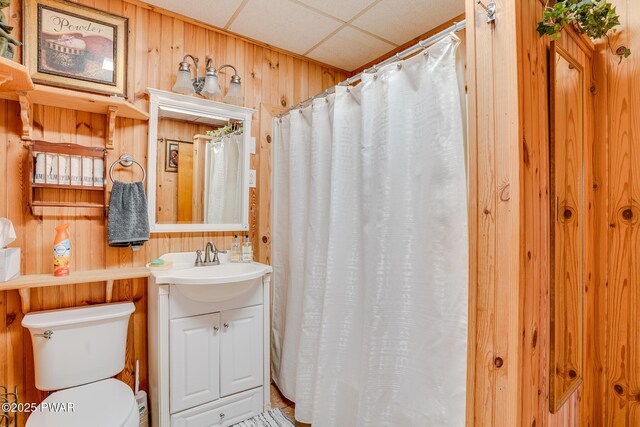 24 Lakeside Dr, Lakeville, PA 18438 - bathroom featuring wooden walls, toilet, vanity, and a shower with shower curtain