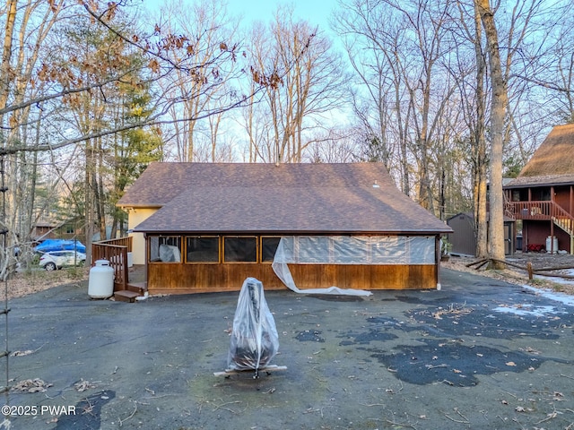 24 Lakeside Dr, Lakeville, PA 18438 - exterior space featuring roof with shingles and a sunroom