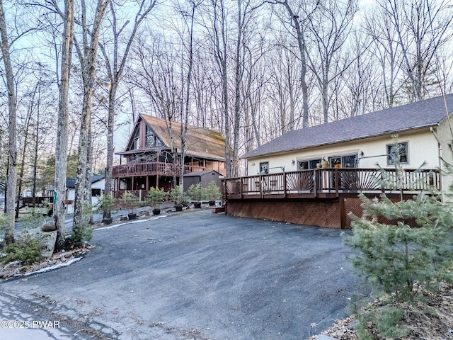24 Lakeside Dr, Lakeville, PA 18438 - back of property with stucco siding and a deck