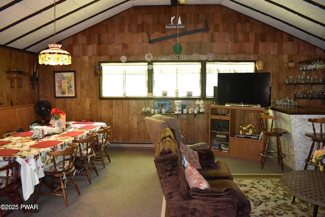 121 Mountain View Dr, Lords Valley, PA 18428 - carpeted dining area with vaulted ceiling, wood walls, and baseboard heating