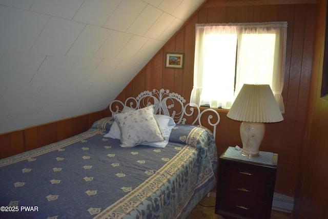 121 Mountain View Dr, Lords Valley, PA 18428 - bedroom with vaulted ceiling, wood walls, and a baseboard heating unit
