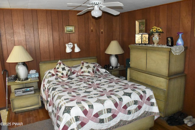 121 Mountain View Dr, Lords Valley, PA 18428 - bedroom featuring wooden walls, wood finished floors, and ceiling fan