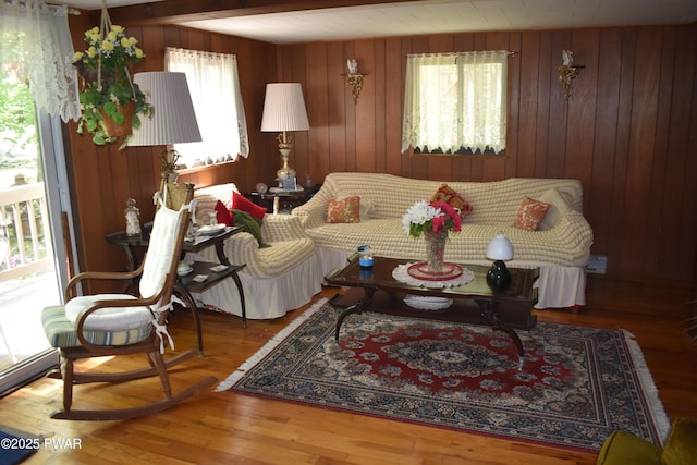 121 Mountain View Dr, Lords Valley, PA 18428 - living area featuring healthy amount of natural light, wood walls, and wood finished floors