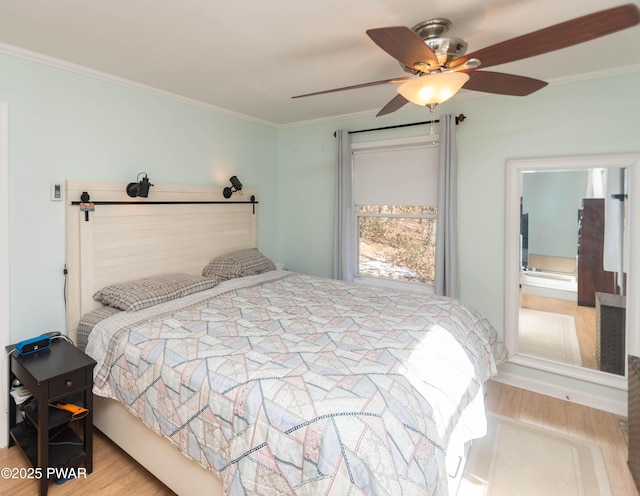 bedroom featuring crown molding, ceiling fan, and light wood-type flooring