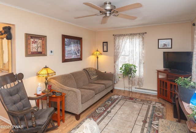 living room featuring wood-type flooring, ornamental molding, ceiling fan, and a baseboard radiator