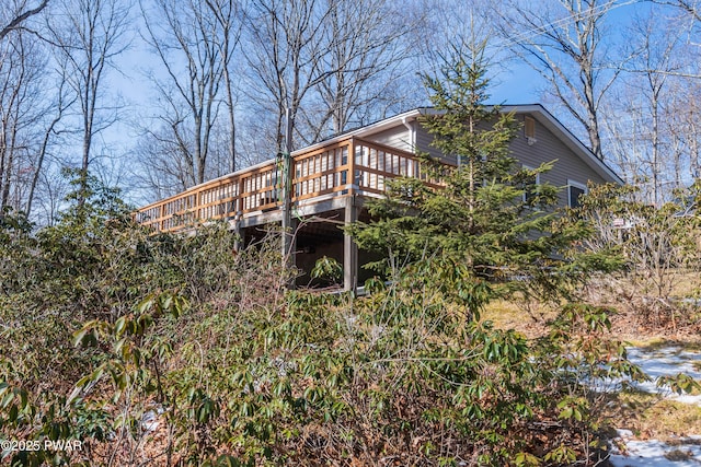 back of house featuring a deck